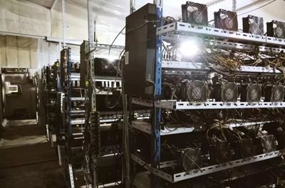 An expansive view of a cryptocurrency mining farm showcasing multiple rigs in operation.